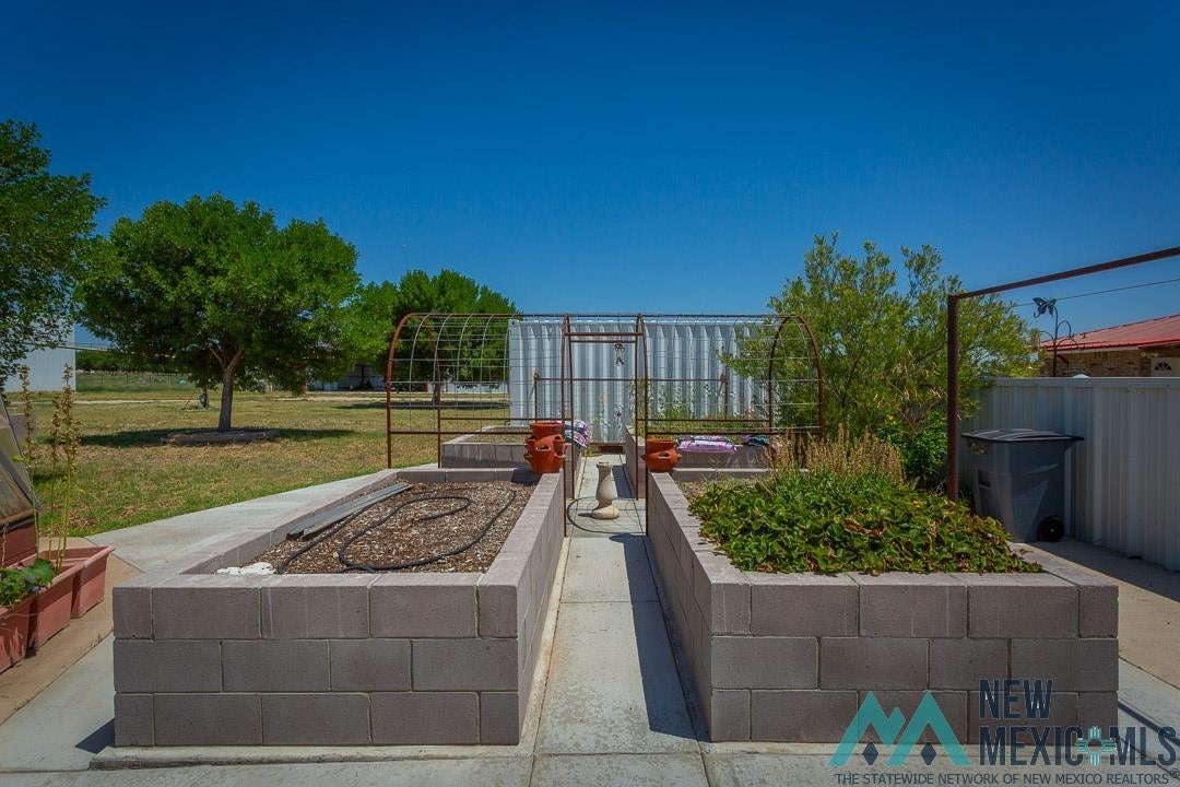 2012 South Haldeman Road Artesia, NM 88210 - Photo 82 of 96 Backyard garden area featuring two raised garden beds constructed from concrete blocks