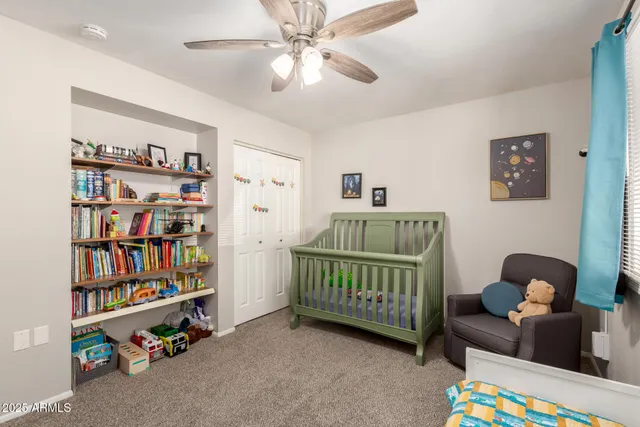 a bedroom with bed and window