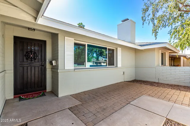 a picture of a room with a white wall and a picture