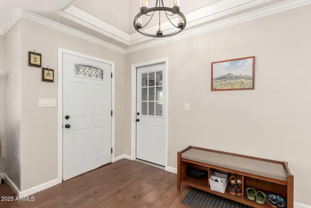 a large kitchen with stainless steel appliances granite countertop a lot of counter space and wooden floor
