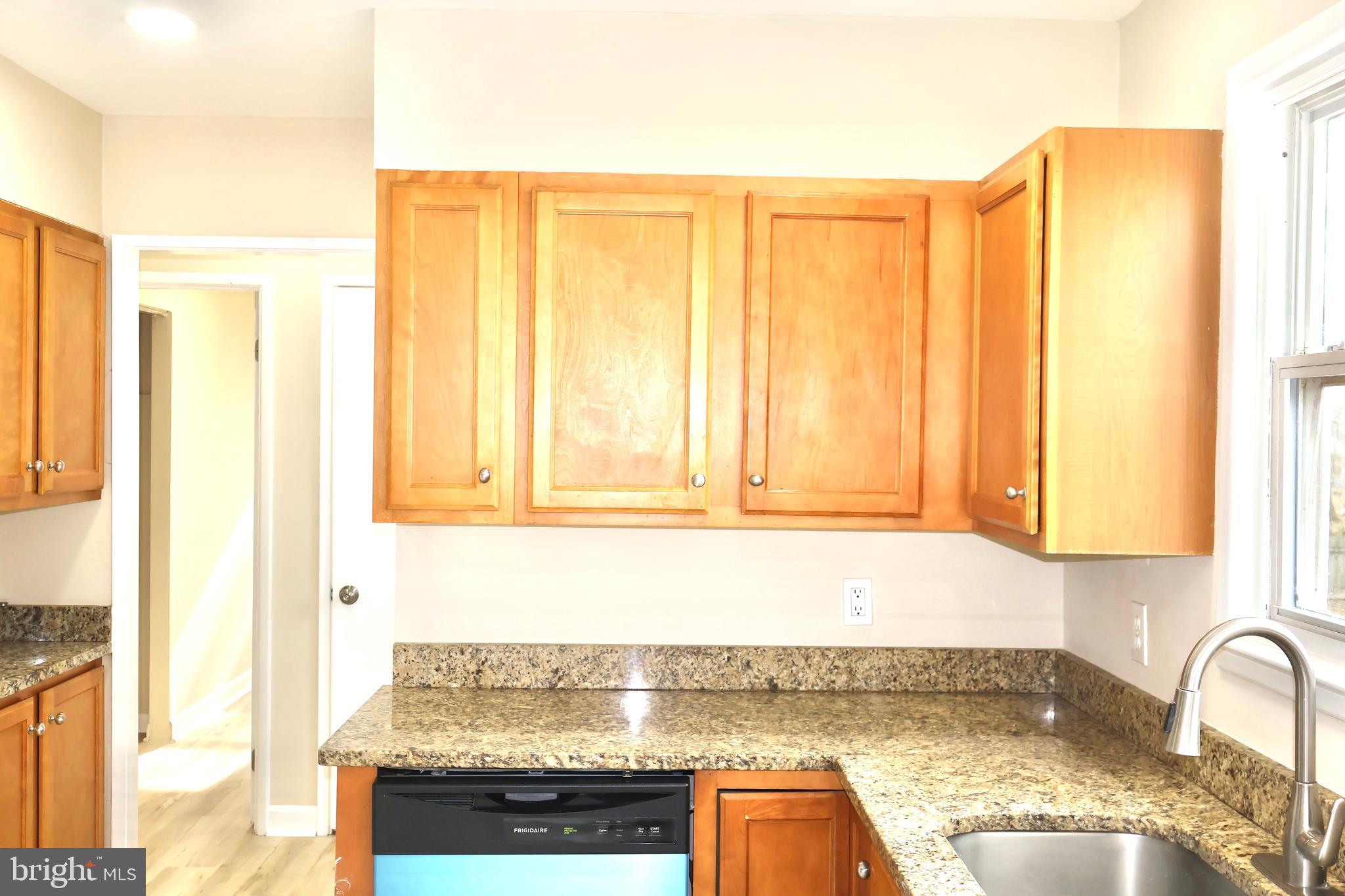 147 Deacon Road Fredericksburg, VA 22405 - Photo 23 of 97 a kitchen with a window cabinets and a counter top space