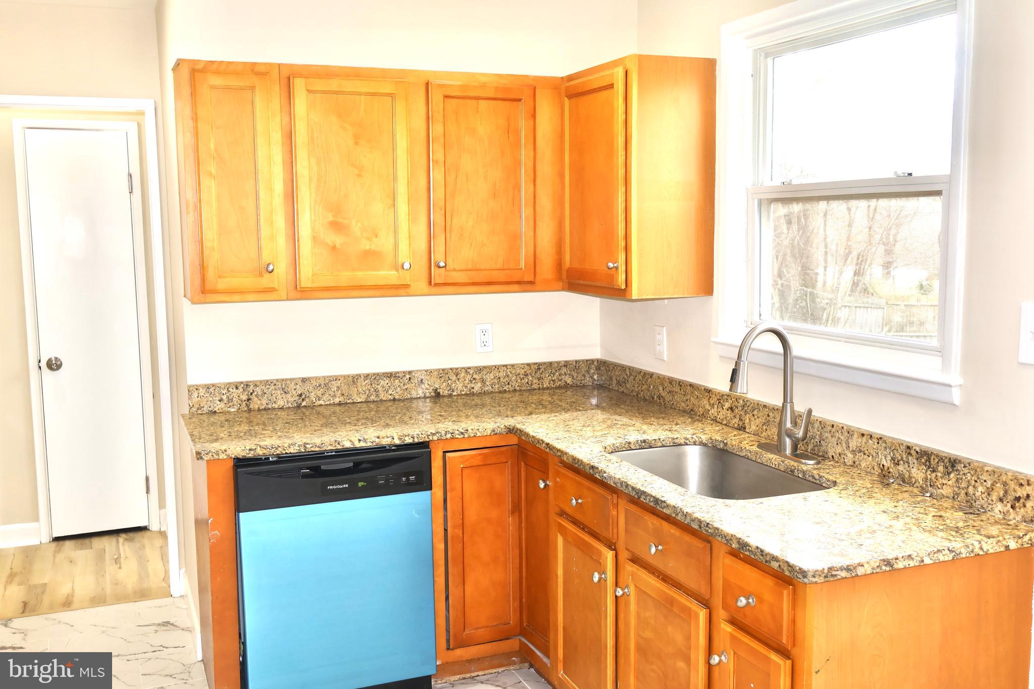147 Deacon Road Fredericksburg, VA 22405 - Photo 24 of 97 a kitchen with stainless steel appliances granite countertop a sink and a granite counter tops with a large window