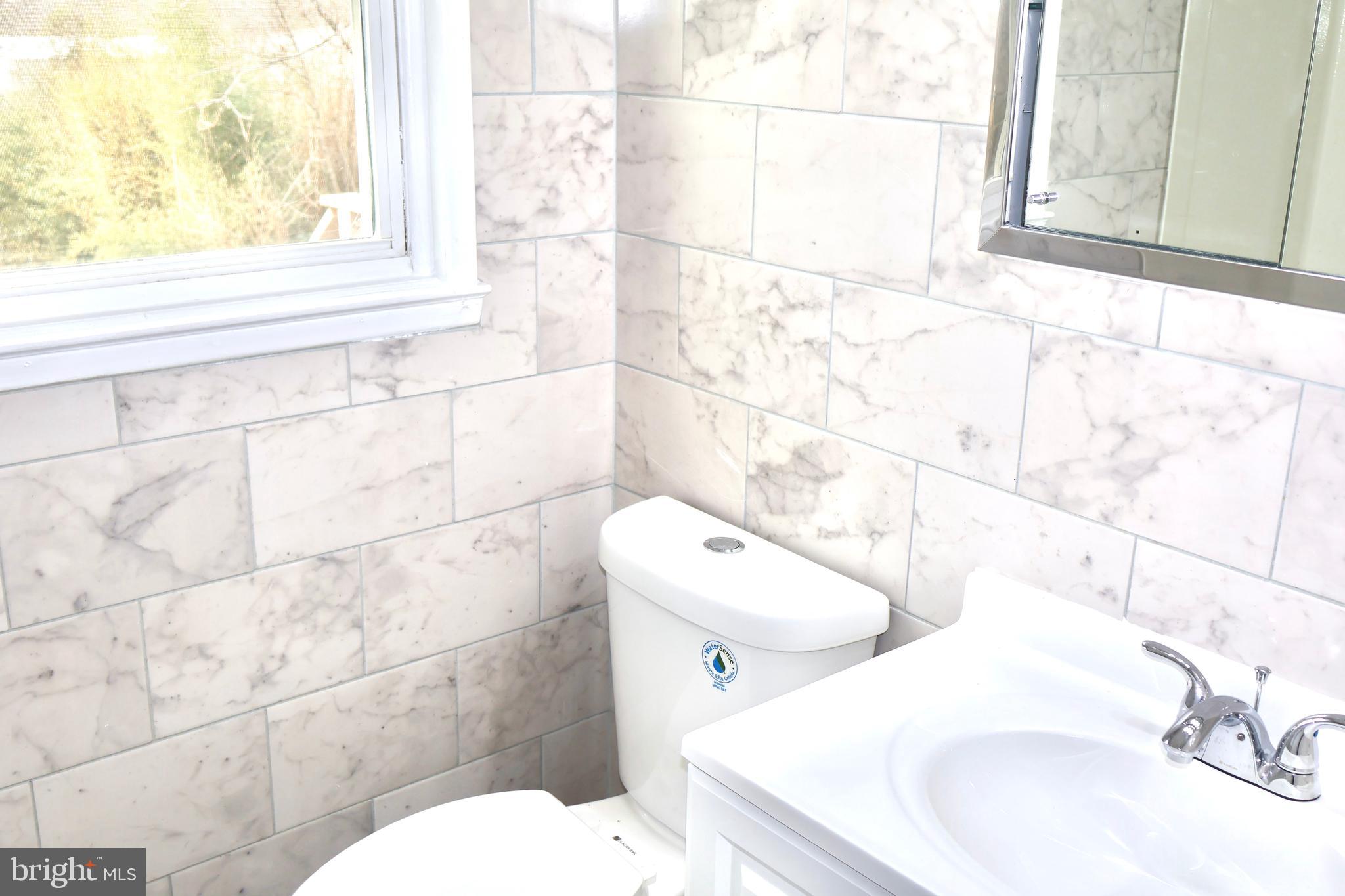 147 Deacon Road Fredericksburg, VA 22405 - Photo 30 of 97 a bathroom with a sink and a toilet