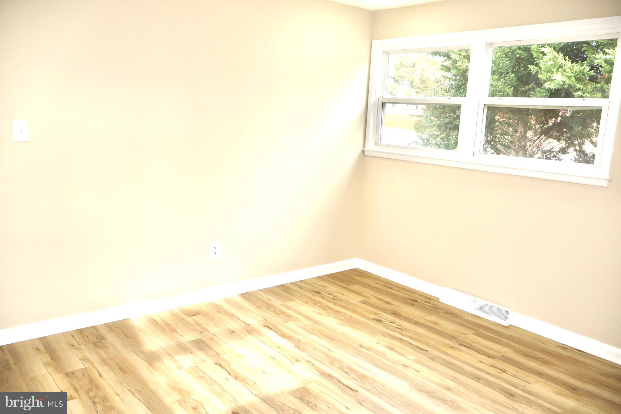 147 Deacon Road Fredericksburg, VA 22405 - Photo 39 of 97 a view of a big room with wooden floor and windows