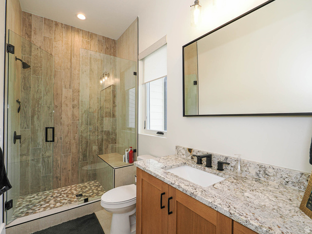 3167 South Mapleton Estates Drive Mapleton, UT 84664 - Photo 25 of 42 Bathroom with vanity, a shower stall, light tile patterned floors, and recessed lighting