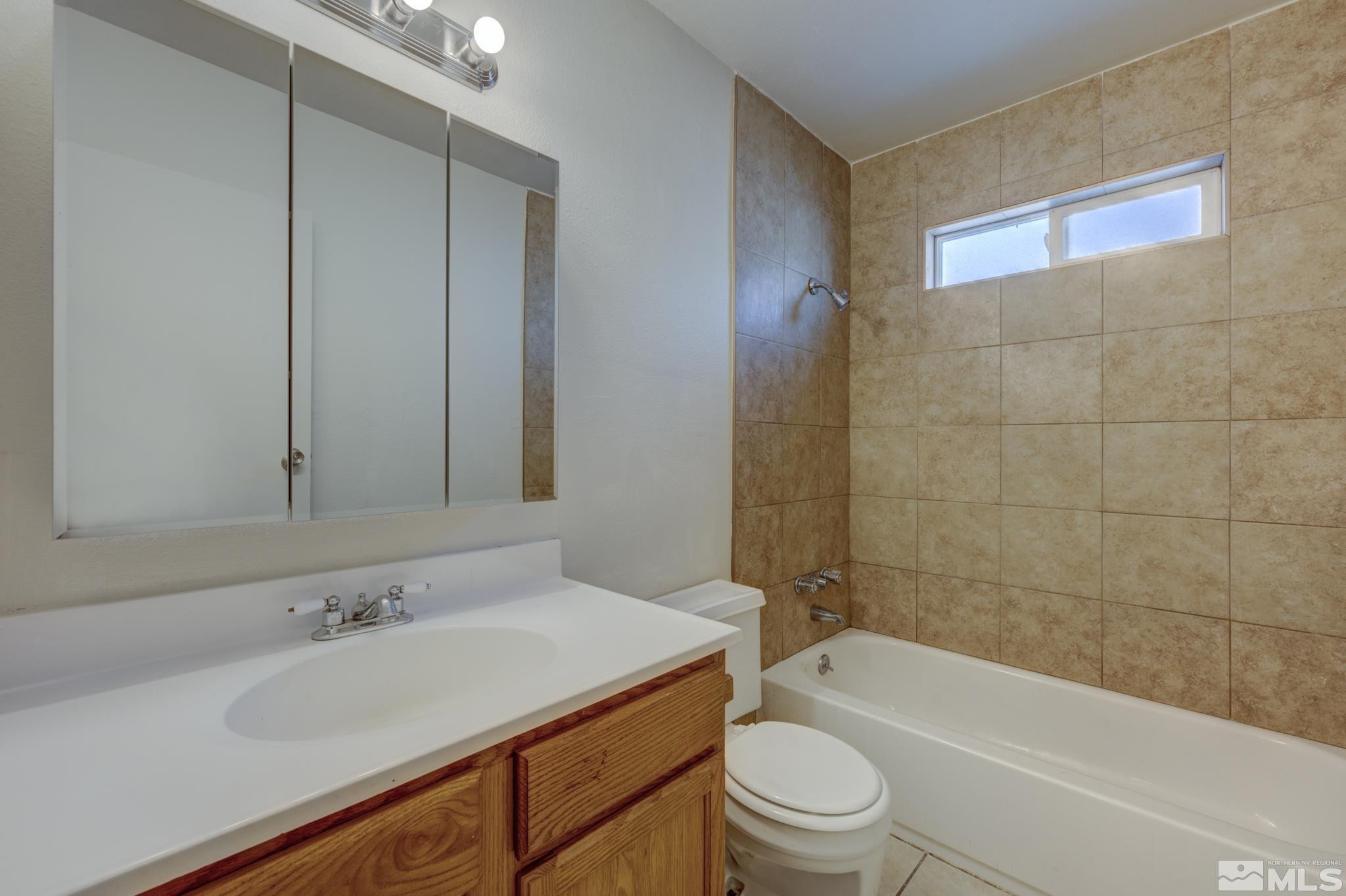 3431 Gypsum Road Reno, NV 89503 - Photo 11 of 13 a bathroom with a sink a toilet and shower