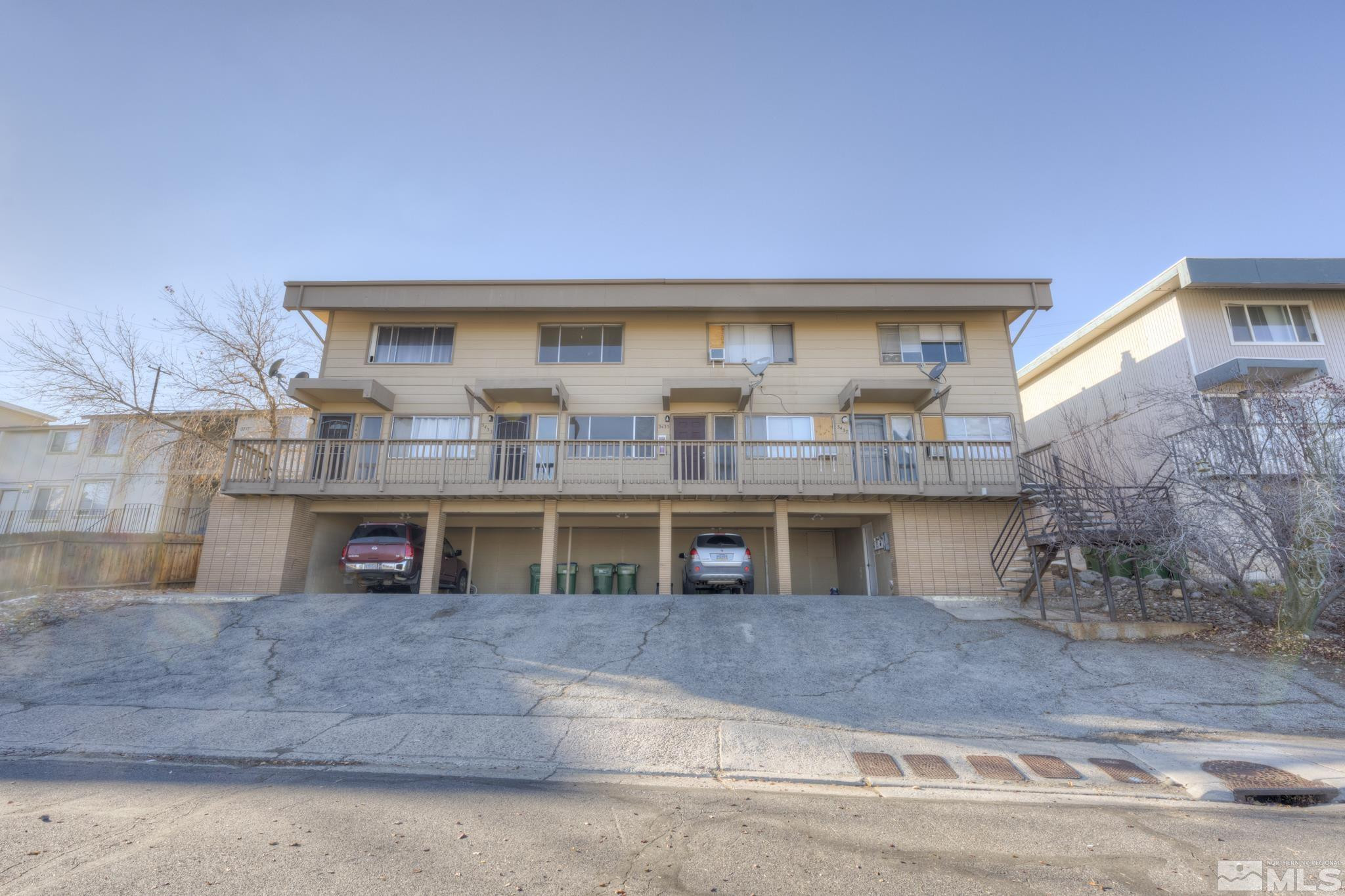3431 Gypsum Road Reno, NV 89503 - Photo 2 of 13 a front view of house with large space and large trees