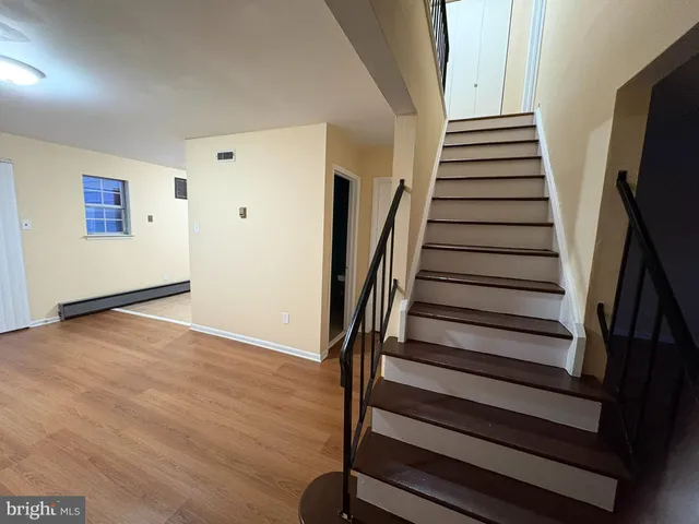 a view of entryway with wooden floor