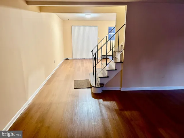 a view of entryway with wooden floor