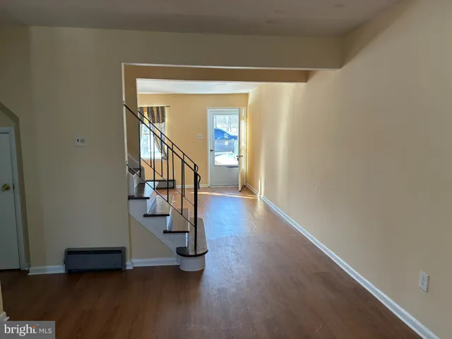 a view of an entryway with wooden floor