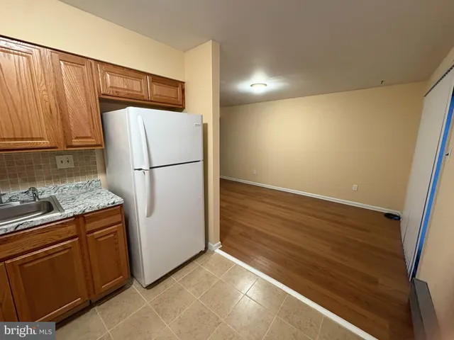 a view of a kitchen with a stove top oven