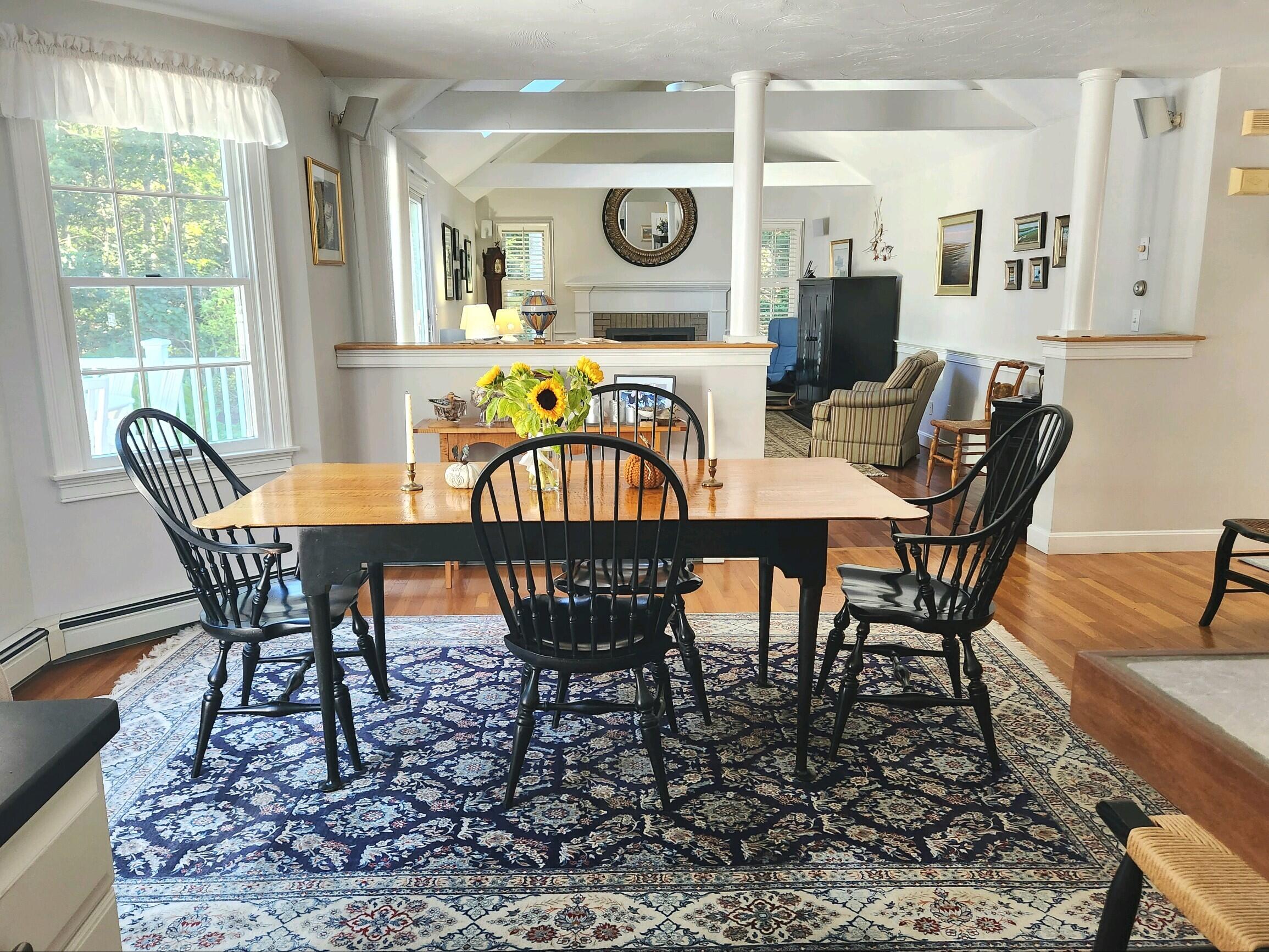 155 Far Fields Road Brewster, MA 02631 - Photo 11 of 40 a view of a dining room with furniture window and outside view
