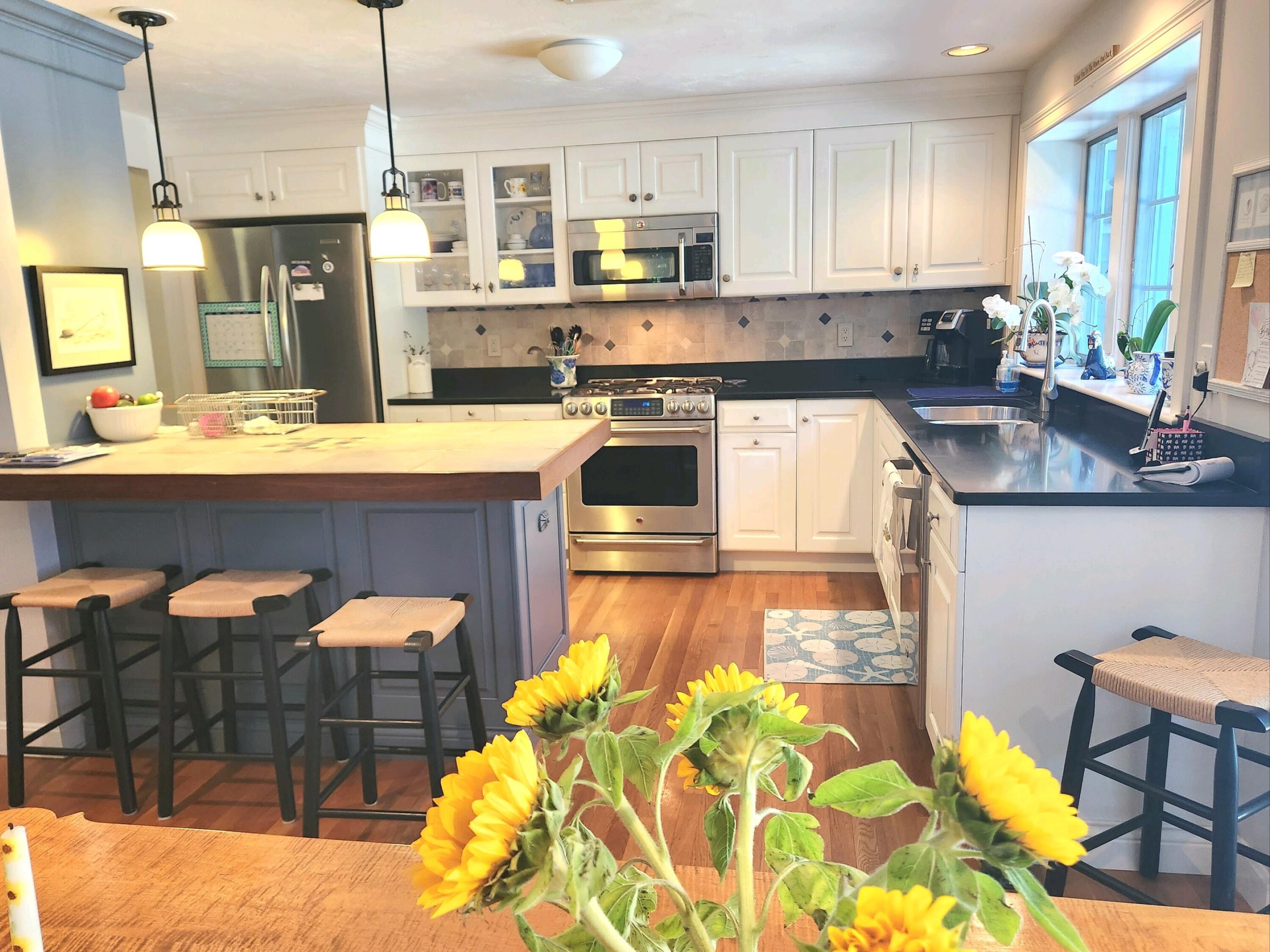 155 Far Fields Road Brewster, MA 02631 - Photo 14 of 40 a kitchen with a sink and cabinets