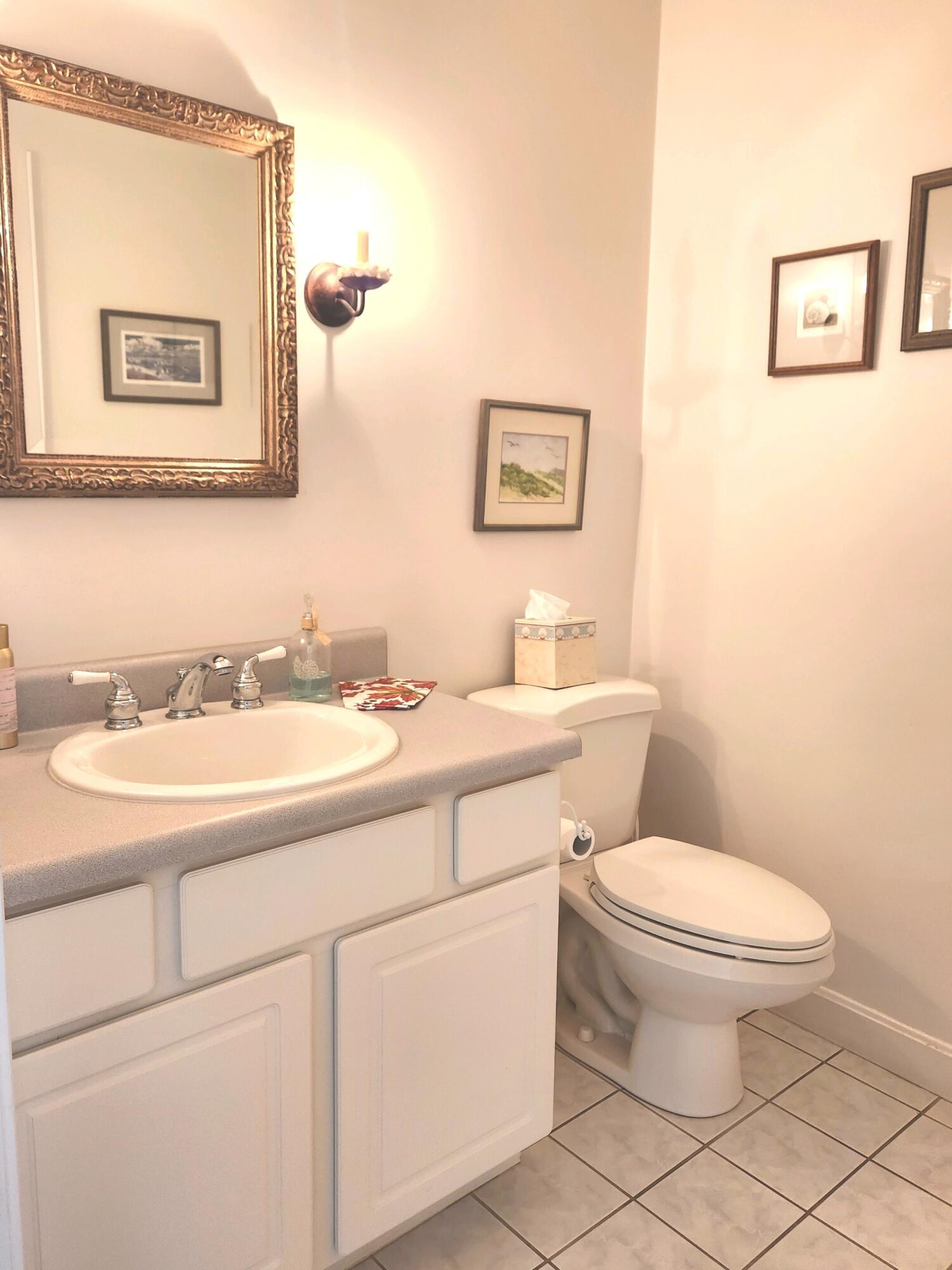 155 Far Fields Road Brewster, MA 02631 - Photo 25 of 40 a bathroom with a toilet sink and mirror
