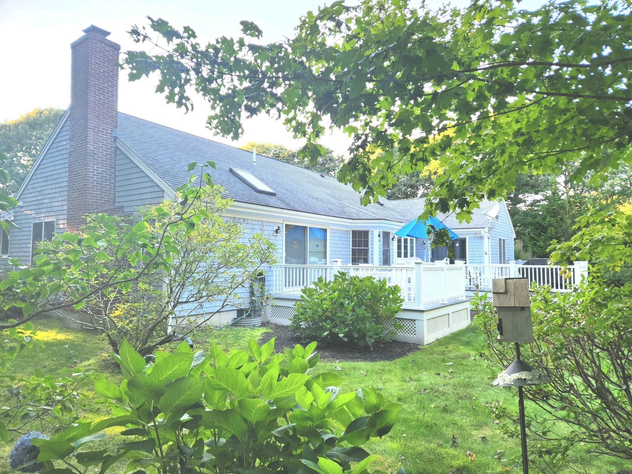155 Far Fields Road Brewster, MA 02631 - Photo 30 of 40 a front view of a house with garden