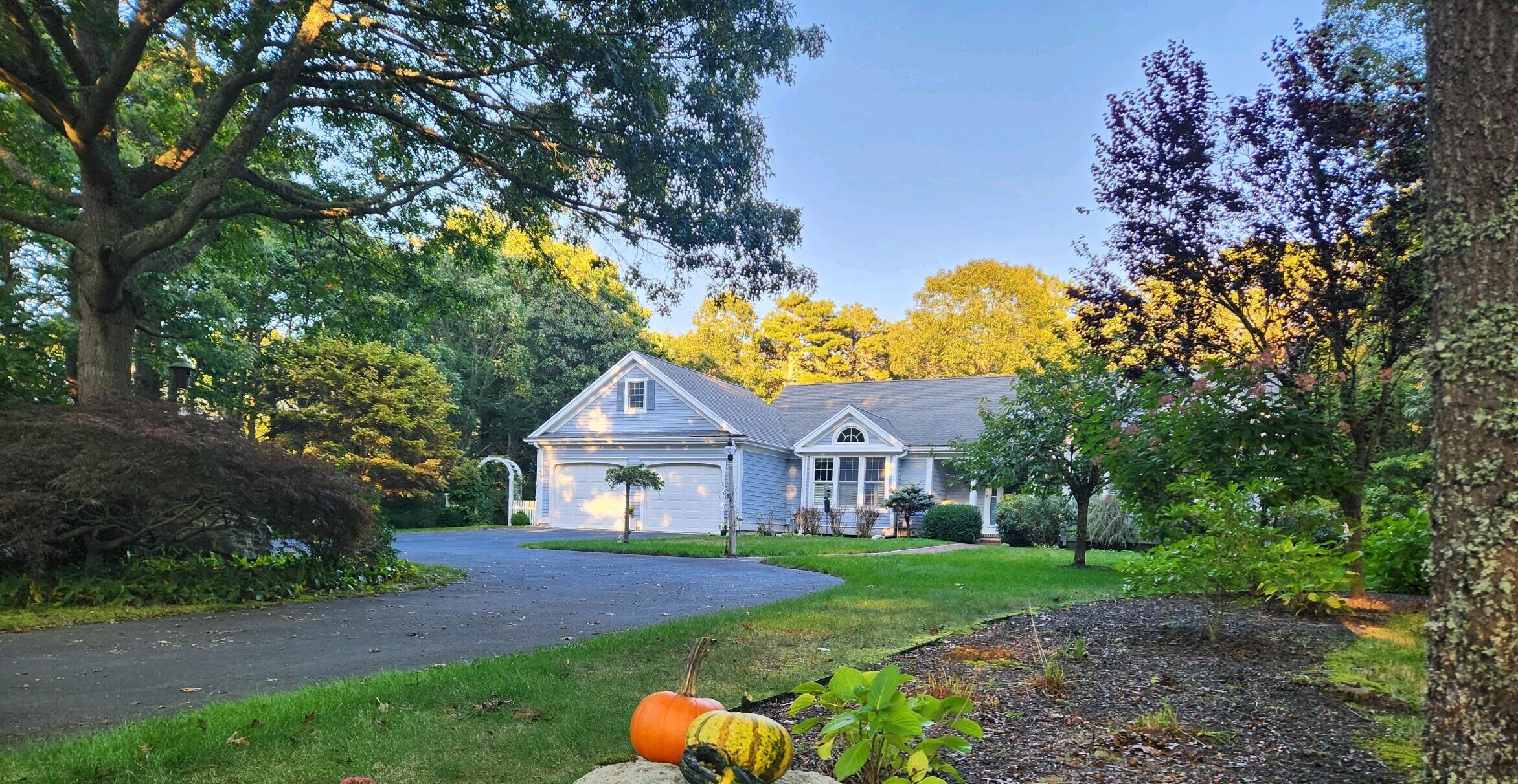 155 Far Fields Road Brewster, MA 02631 - Photo 34 of 40 a front view of a house with garden