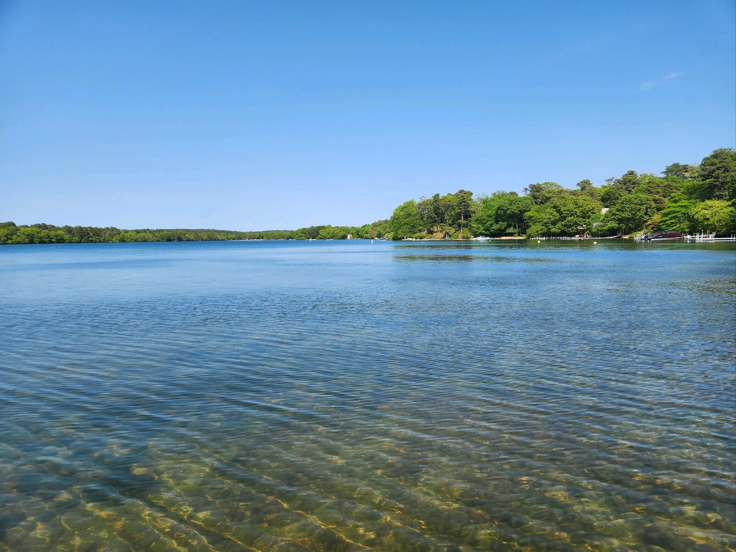 155 Far Fields Road Brewster, MA 02631 - Photo 36 of 40 a view of an ocean beach and mountain