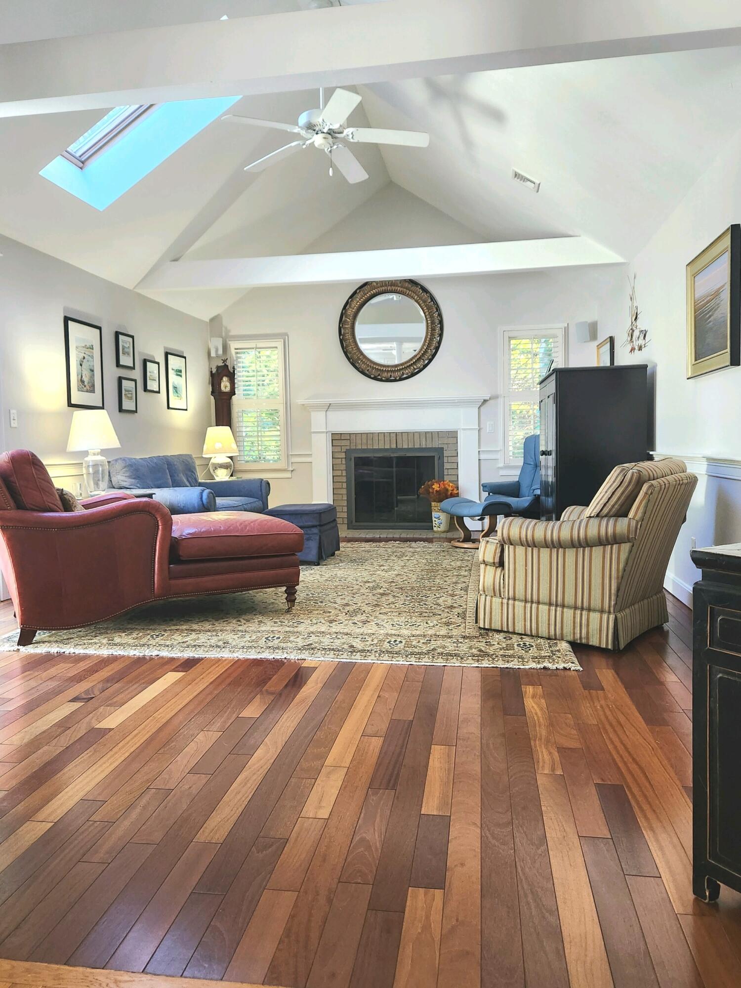 155 Far Fields Road Brewster, MA 02631 - Photo 6 of 40 a living room with furniture and a fireplace