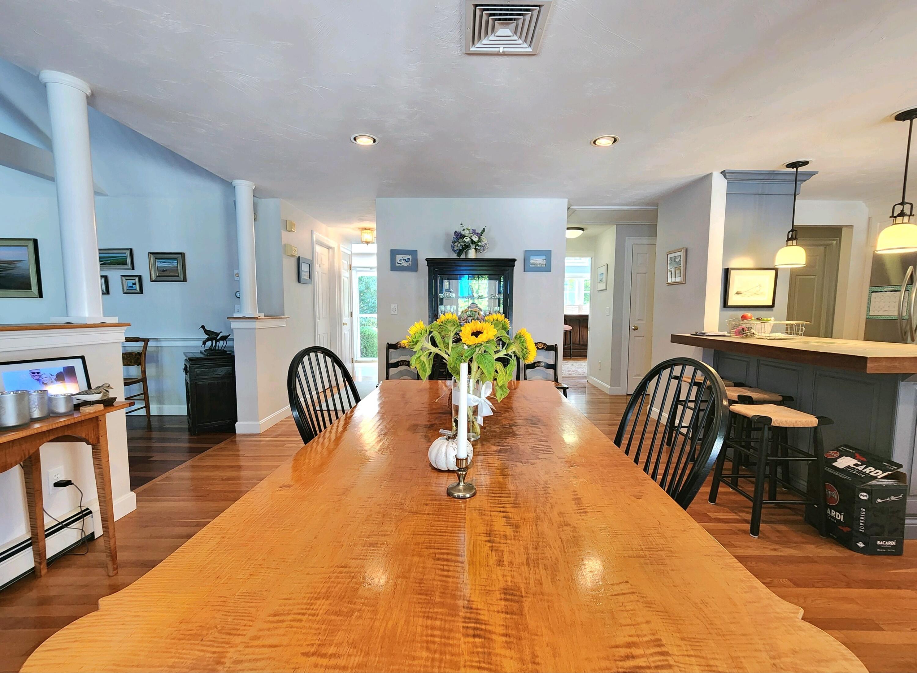 155 Far Fields Road Brewster, MA 02631 - Photo 7 of 40 a dining room with furniture and chandelier