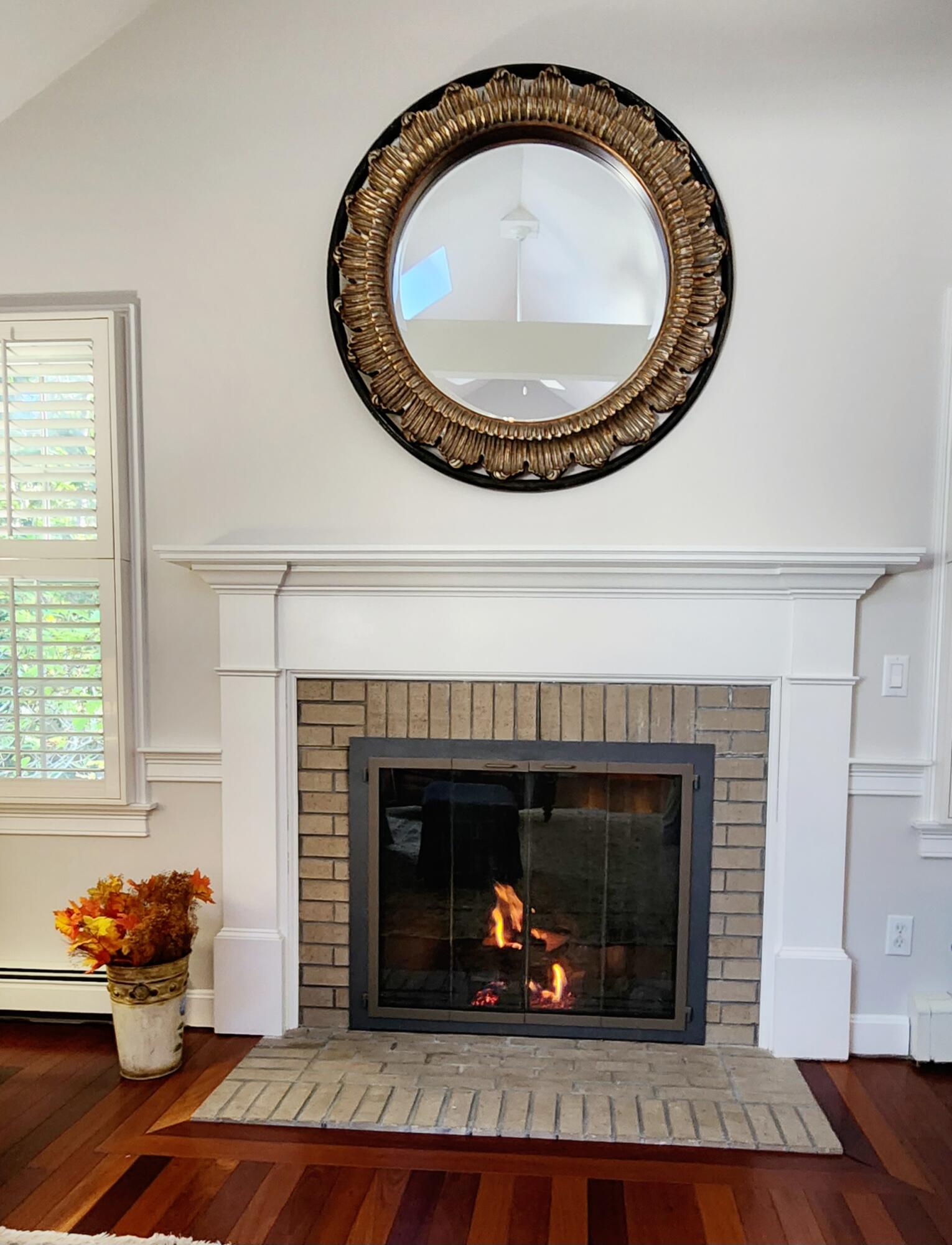 155 Far Fields Road Brewster, MA 02631 - Photo 8 of 40 a living room with furniture and a fireplace