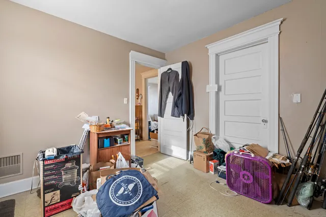 a bedroom with furniture and a window