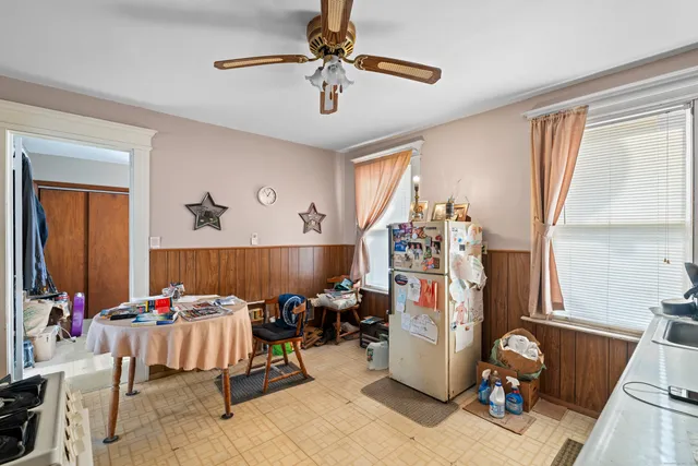 a bedroom with a bed and a table in it