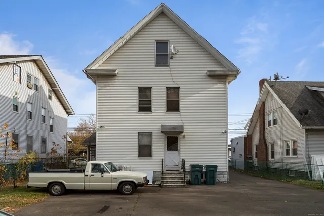 a view of a house with a yard and garage