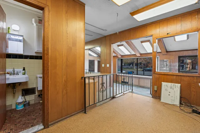 a view of hall way with furniture