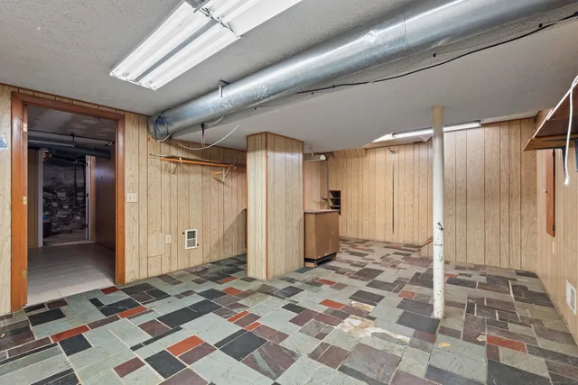 a living room with furniture and windows