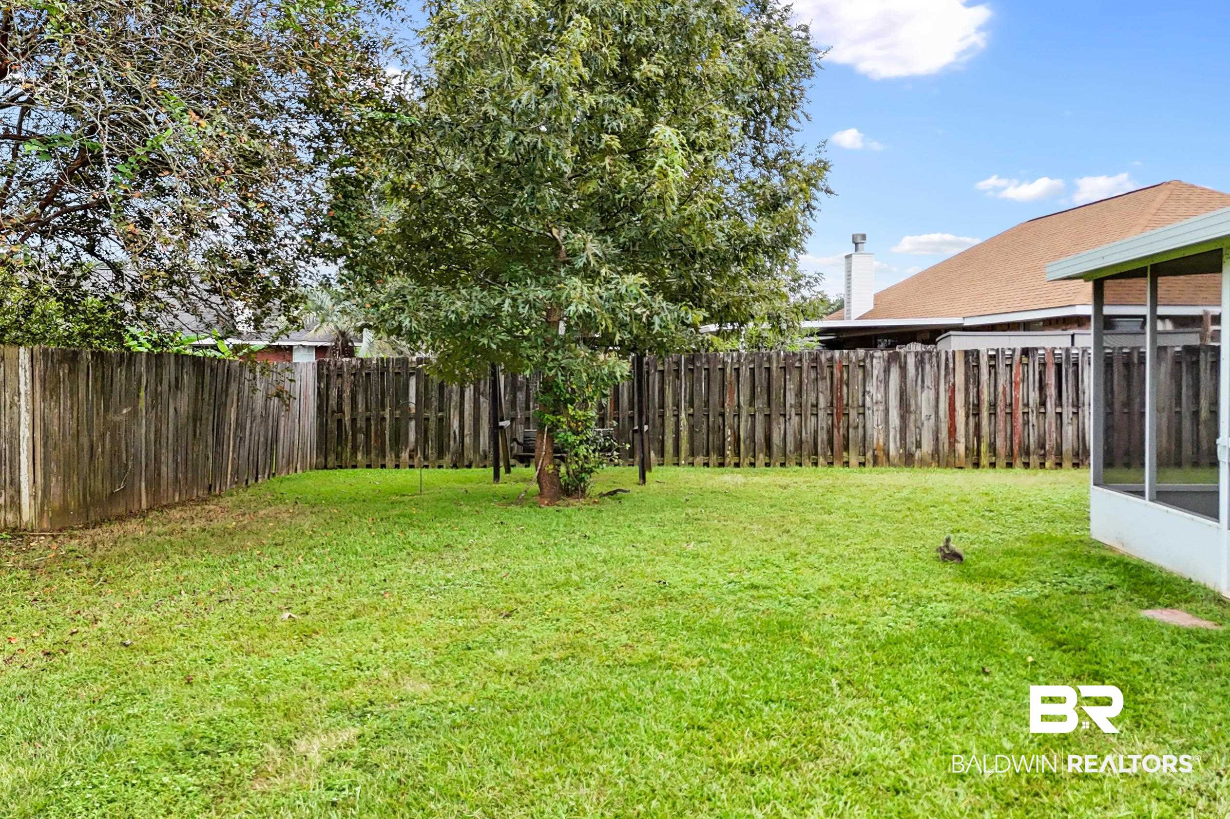 306 Monteith Oaks Drive Foley, AL 36535 - Photo 27 of 38 Fenced backyard featuring a sunroom