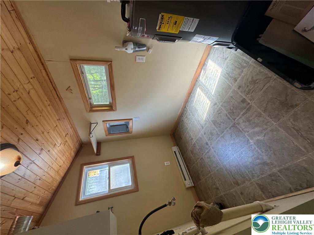 134 Bear Road Kunkletown, PA 18058 - Photo 22 of 42 A functional utility space displays stone-look tile flooring and a vaulted tongue-and-groove wood ceiling.