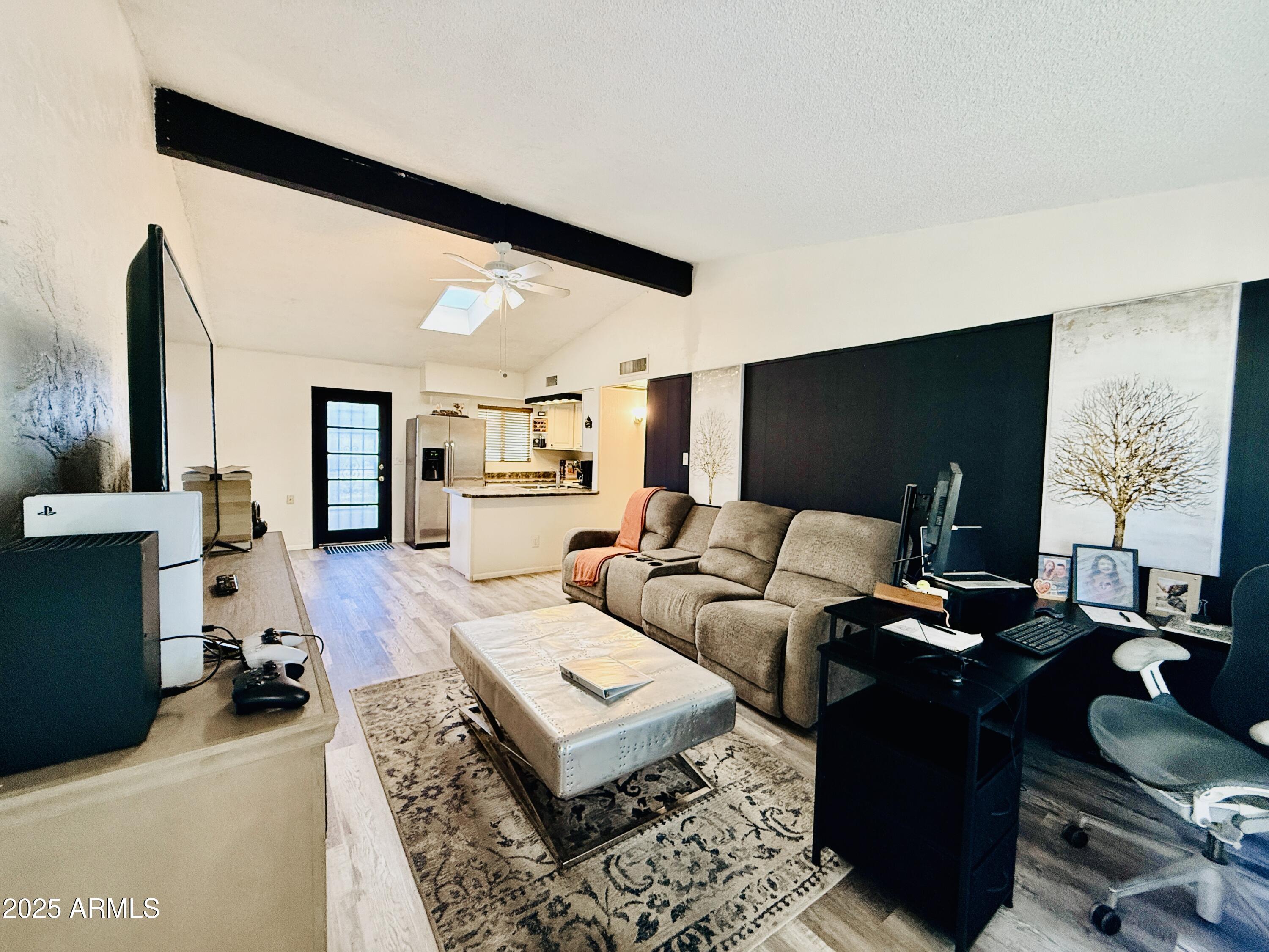 625 South Power Road, Unit 350 Mesa, AZ 85206 - Photo 11 of 20 a living room with furniture and a flat screen tv