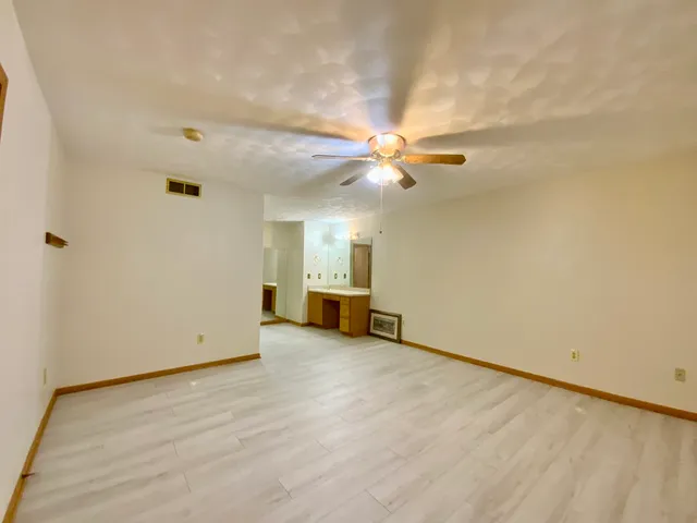 a bathroom with a tub and shower