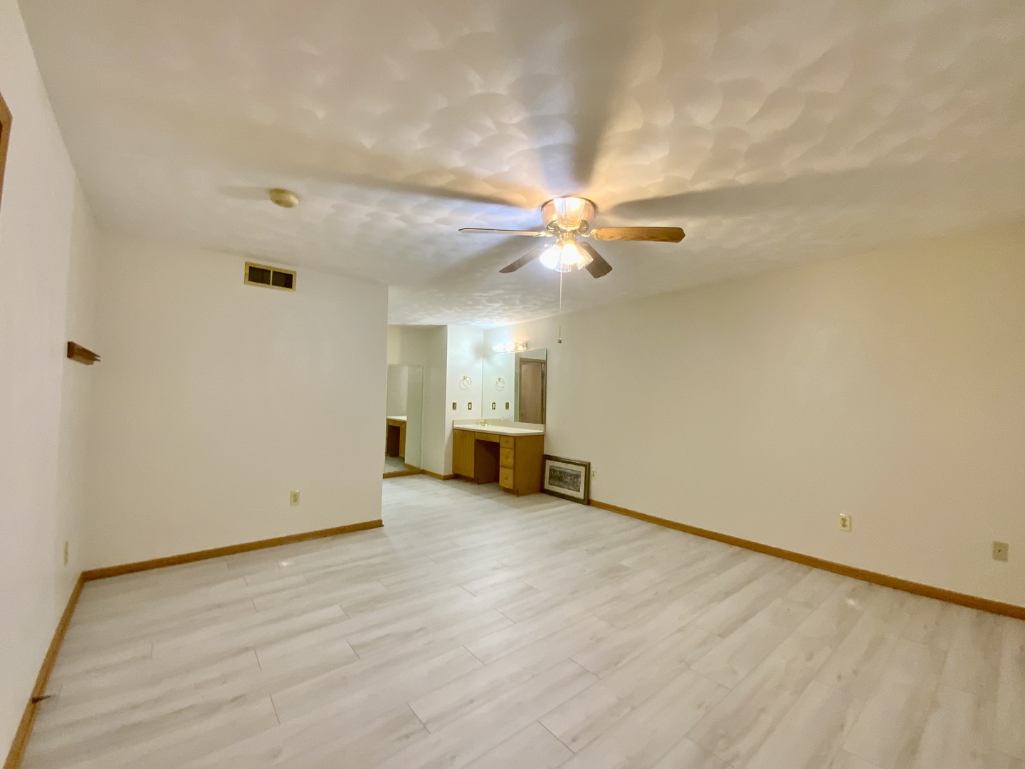 3121 Carefree Drive Rockford, IL 61114 - Photo 11 of 29 an empty room with wooden floor fan and windows