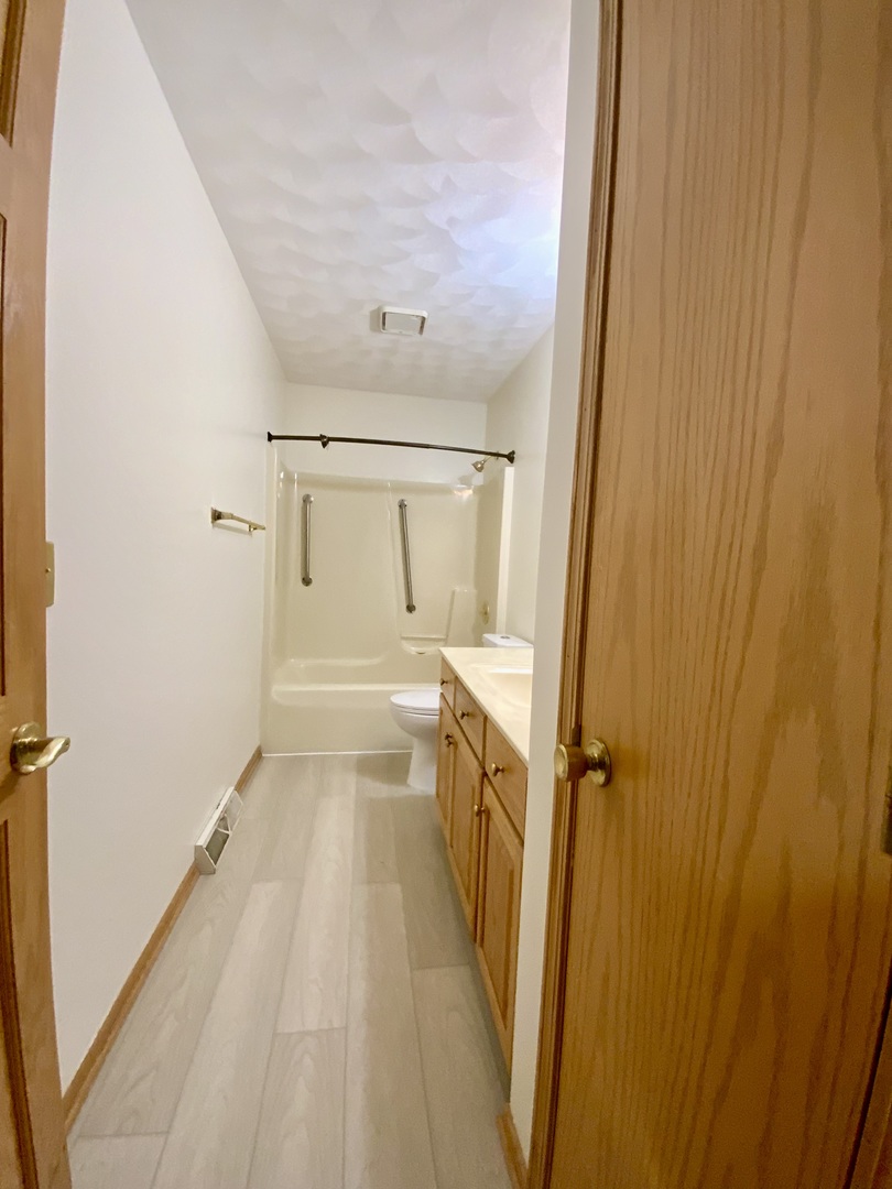 3121 Carefree Drive Rockford, IL 61114 - Photo 12 of 29 a bathroom with a tub and shower