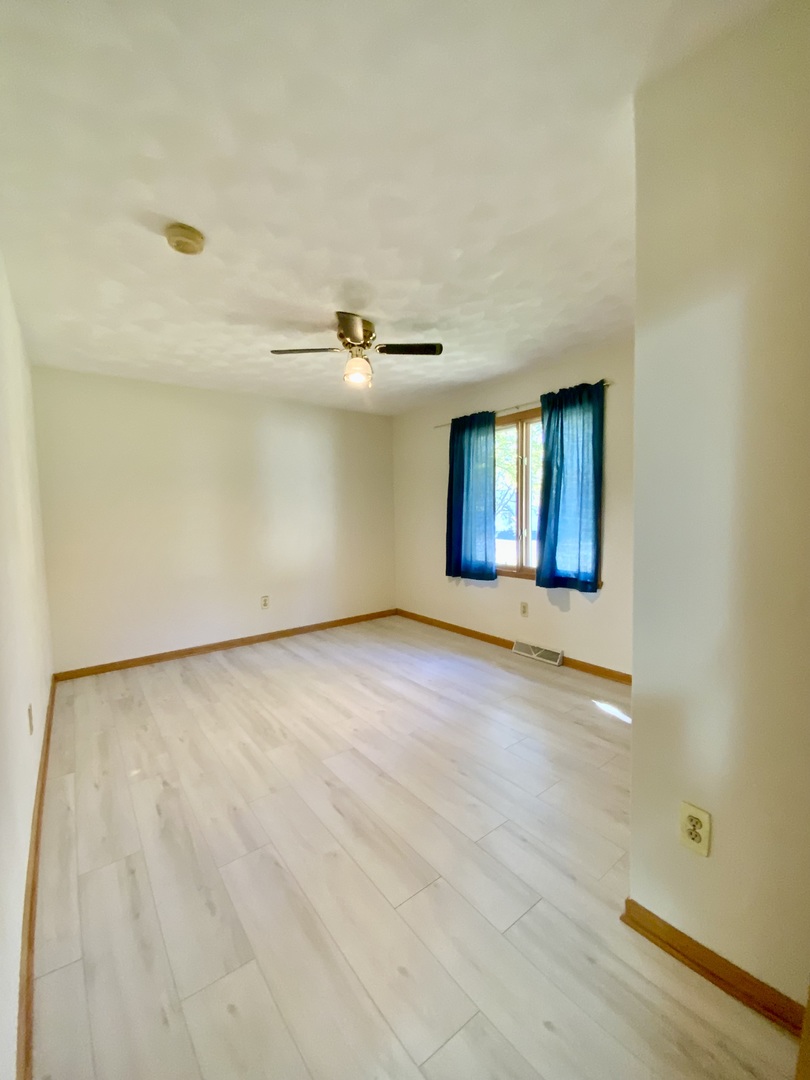 3121 Carefree Drive Rockford, IL 61114 - Photo 16 of 29 a view of an empty room with windows