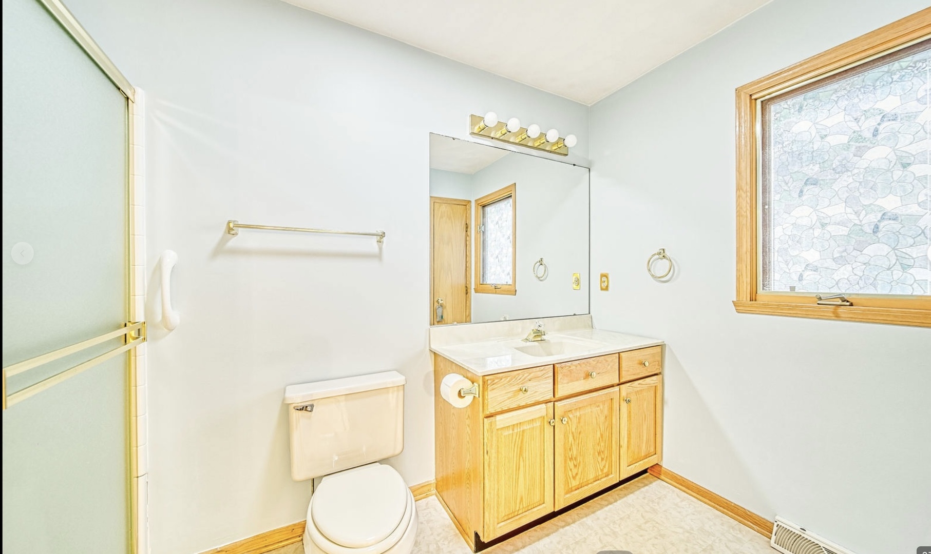 3121 Carefree Drive Rockford, IL 61114 - Photo 17 of 29 a bathroom with a sink a mirror and a shower