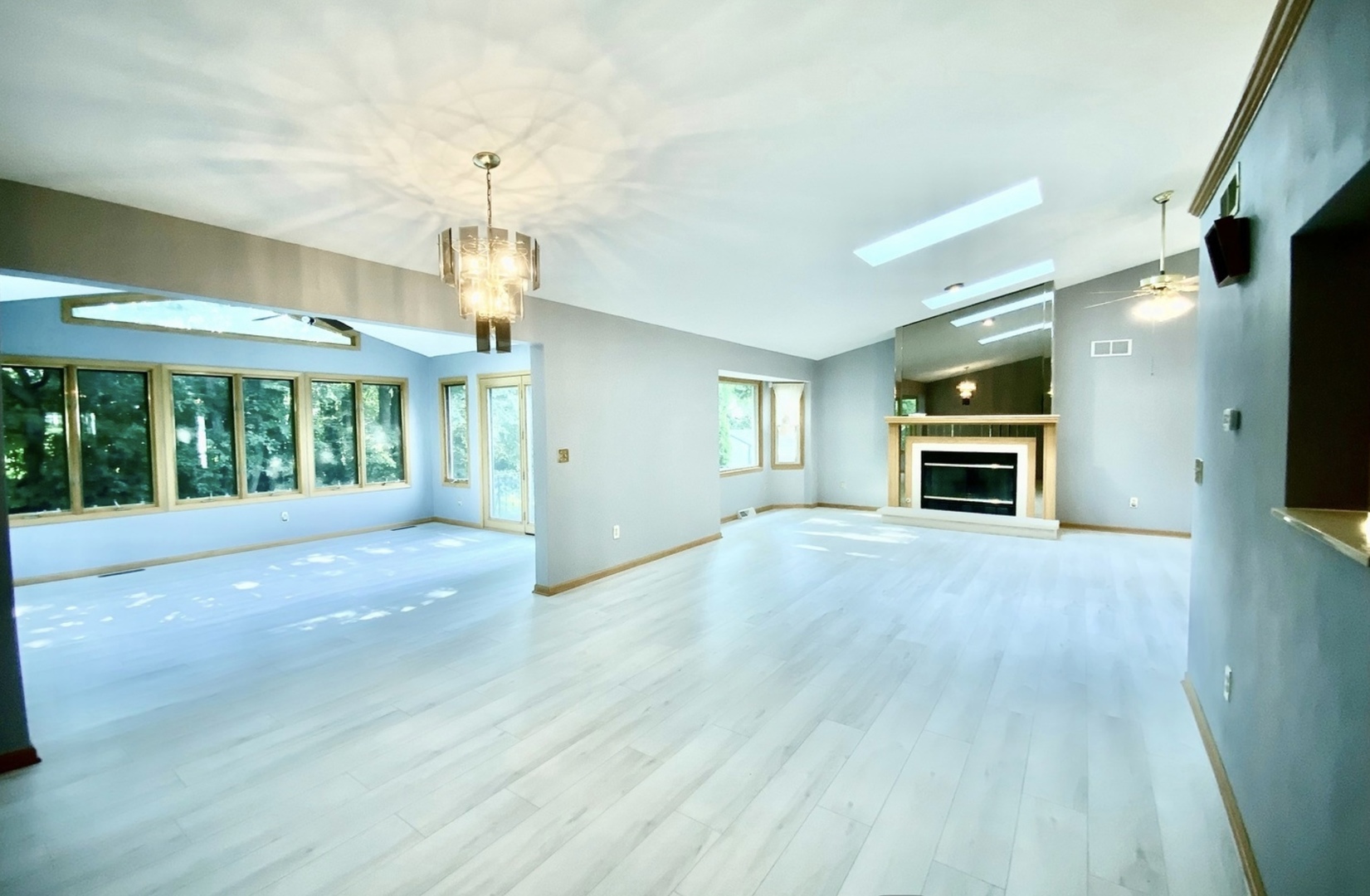 3121 Carefree Drive Rockford, IL 61114 - Photo 4 of 29 a view of an empty room with a window and fireplace