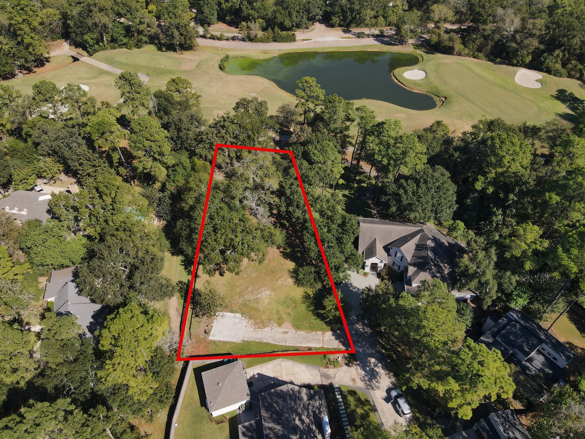 10816 Colony Wood Place Spring, TX 77380 - Photo 3 of 15 an aerial view of a house with a yard swimming pool a patio and lake view