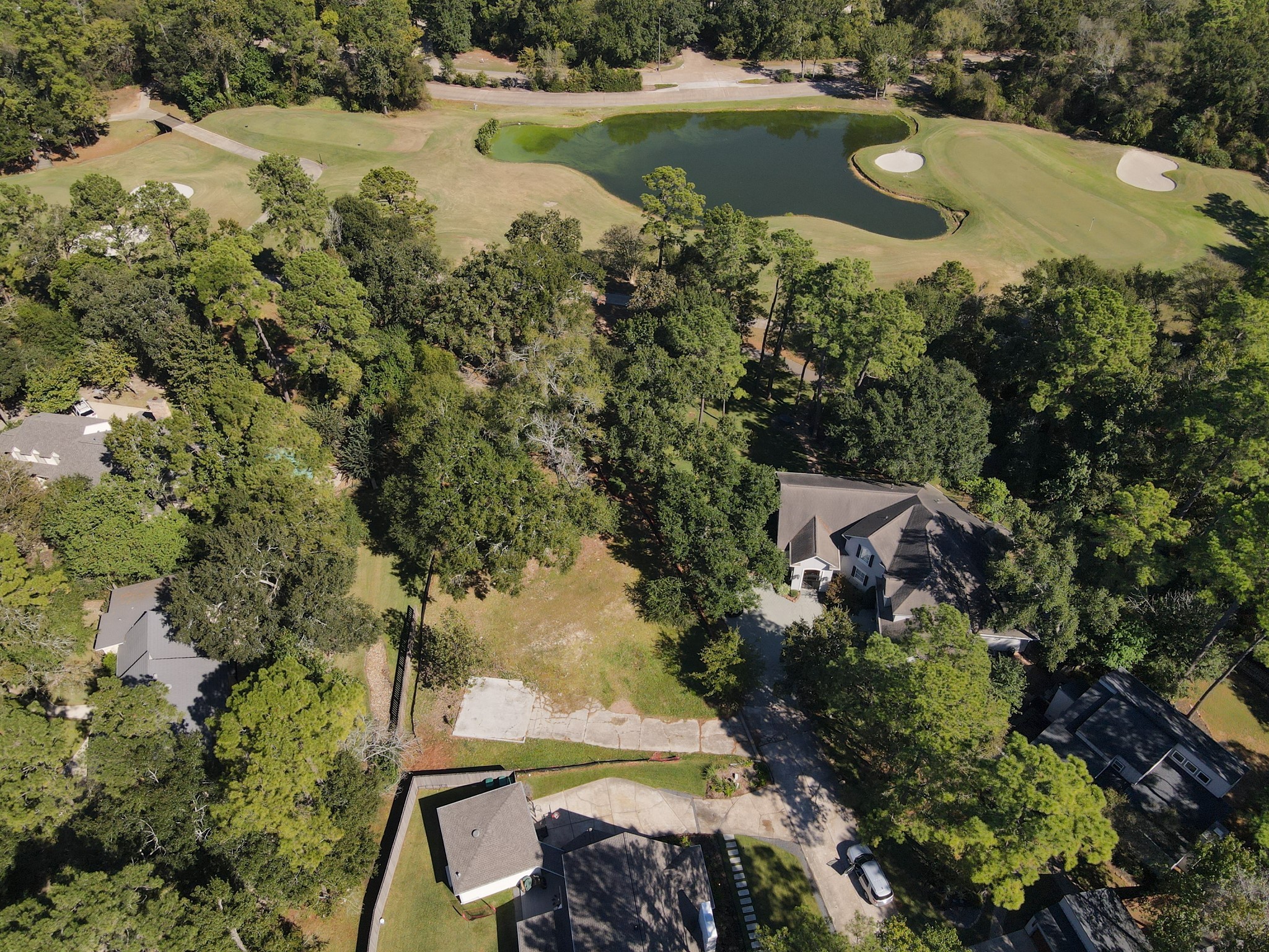 10816 Colony Wood Place Spring, TX 77380 - Photo 4 of 15 a view of a lake with outdoor space