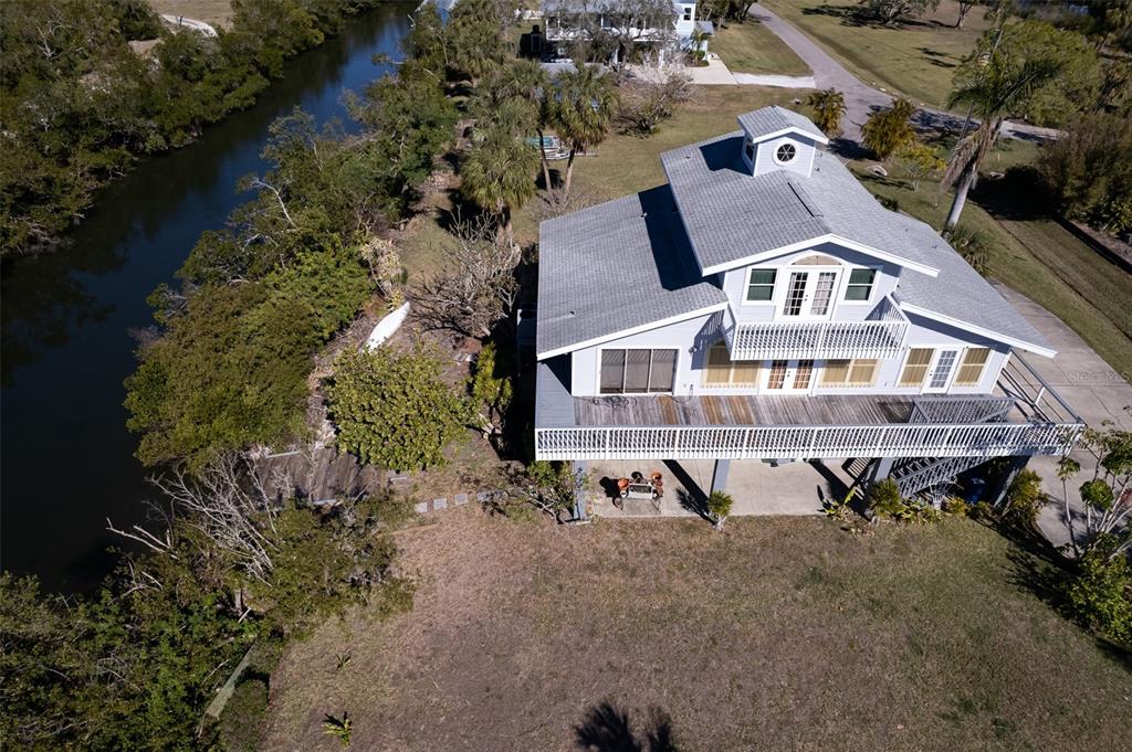 145 Burns Road Terra Ceia, FL 34250 - Photo 3 of 65 an aerial view of a house with a yard