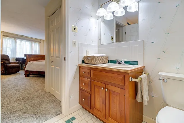 a bathroom with a sink a vanity and a mirror