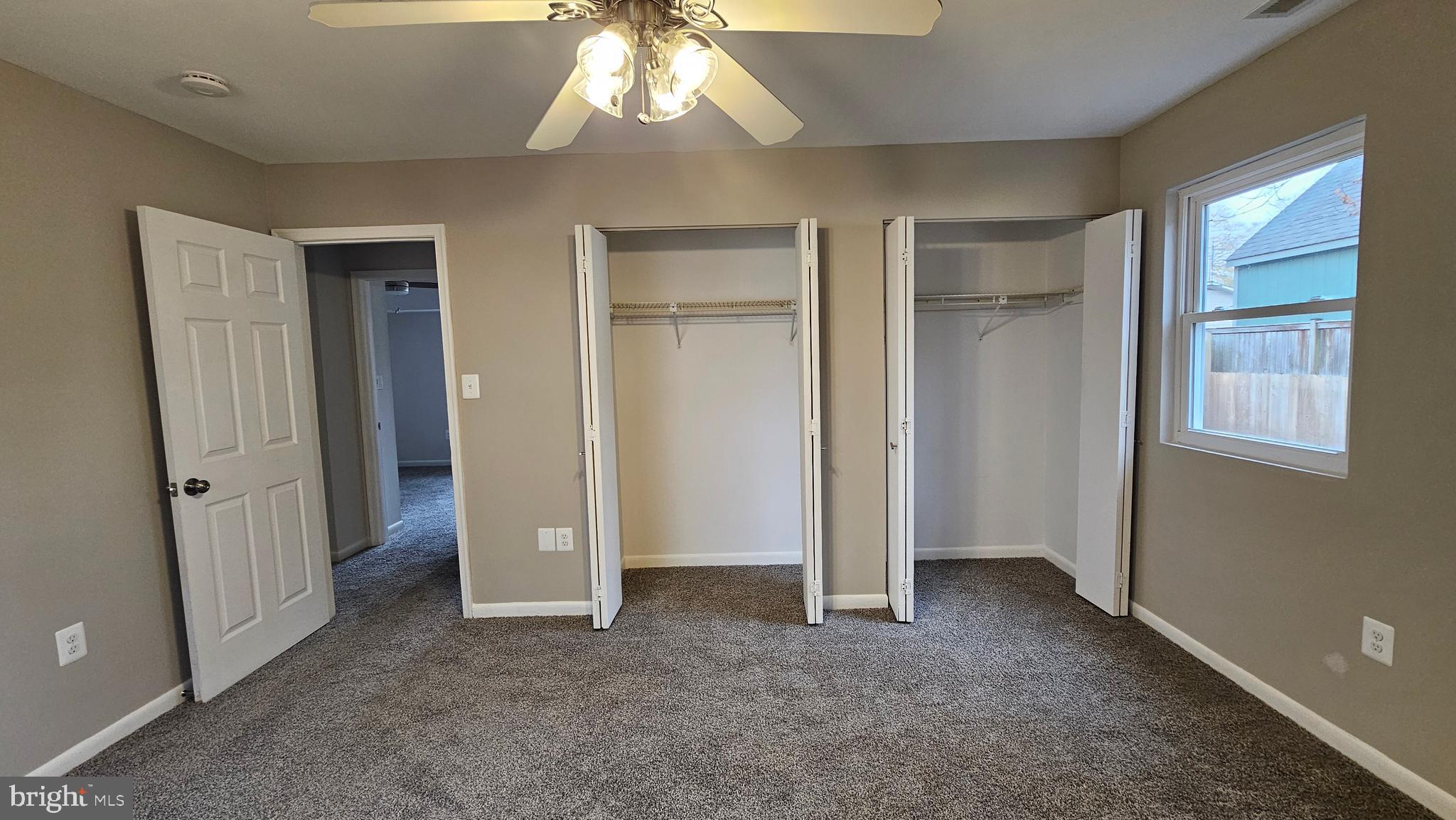 654 Emmett Place North Beach, MD 20714 - Photo 11 of 24 an empty room with closet and a chandelier fan