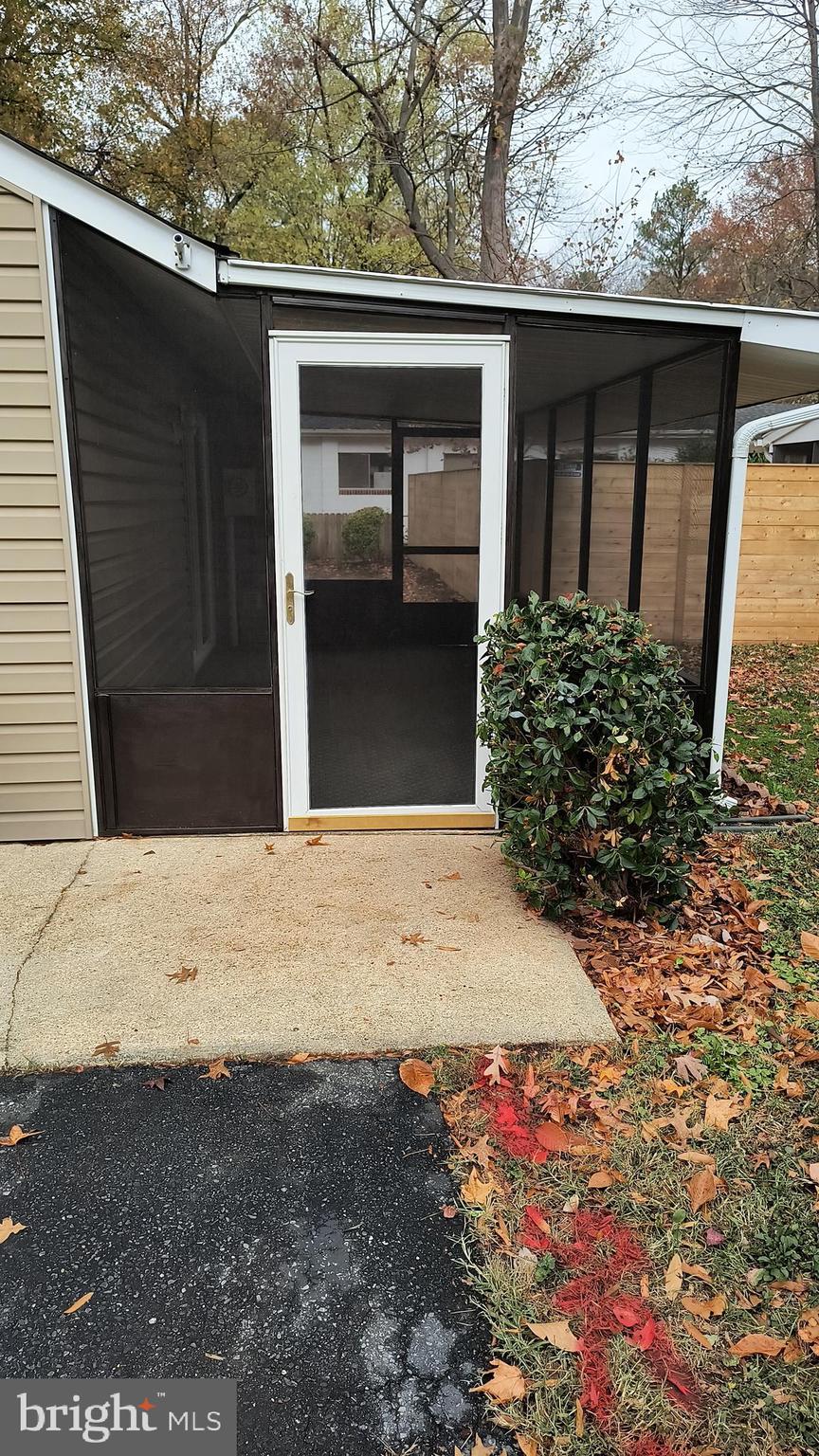 654 Emmett Place North Beach, MD 20714 - Photo 19 of 24 a view of a backyard of the house