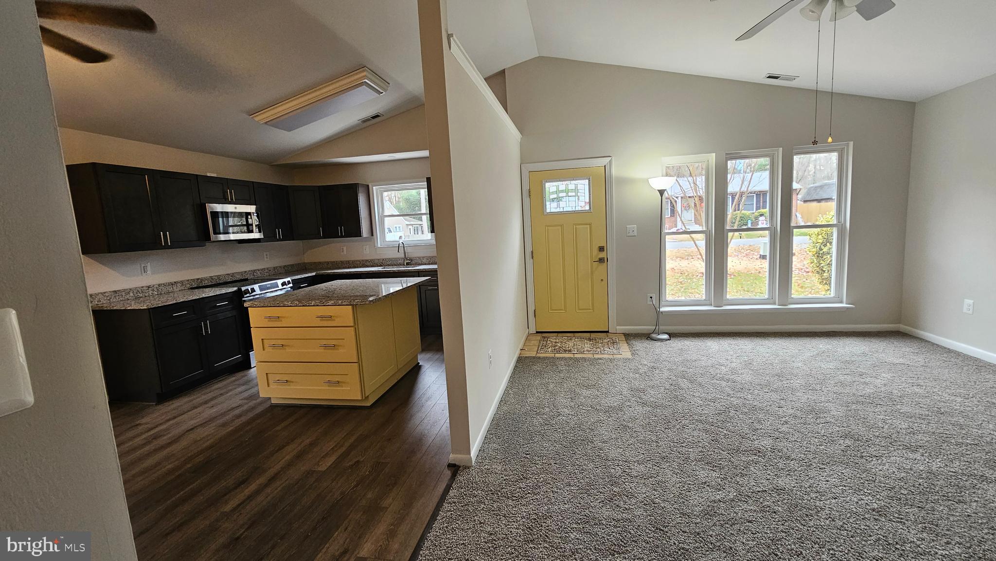 654 Emmett Place North Beach, MD 20714 - Photo 2 of 24 a view of a kitchen with wooden floor and electronic appliances