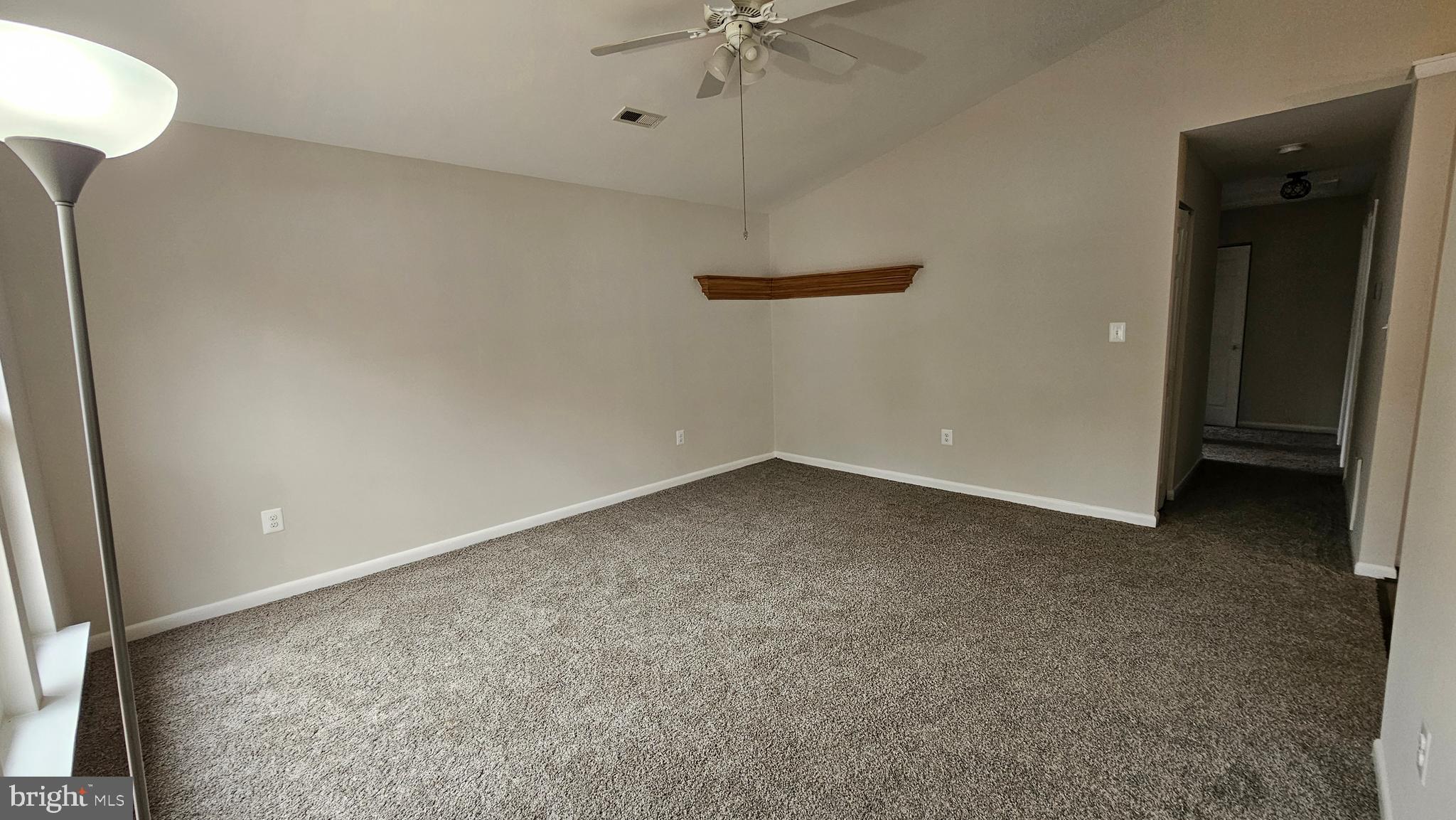 654 Emmett Place North Beach, MD 20714 - Photo 8 of 24 a view of a room with a ceiling fan