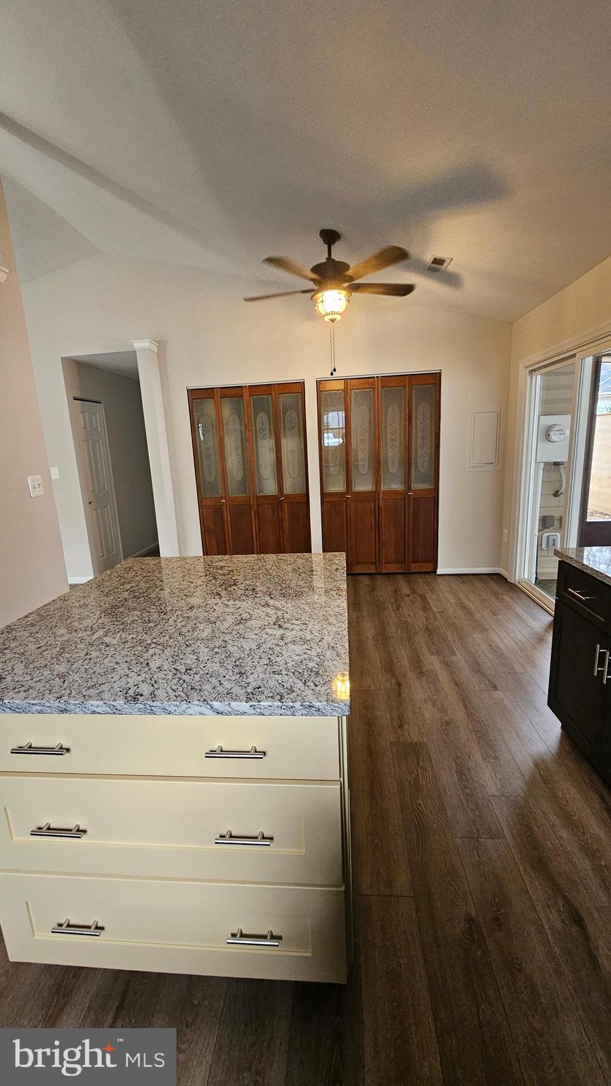 654 Emmett Place North Beach, MD 20714 - Photo 9 of 24 a view of living room with granite countertop furniture and fireplace