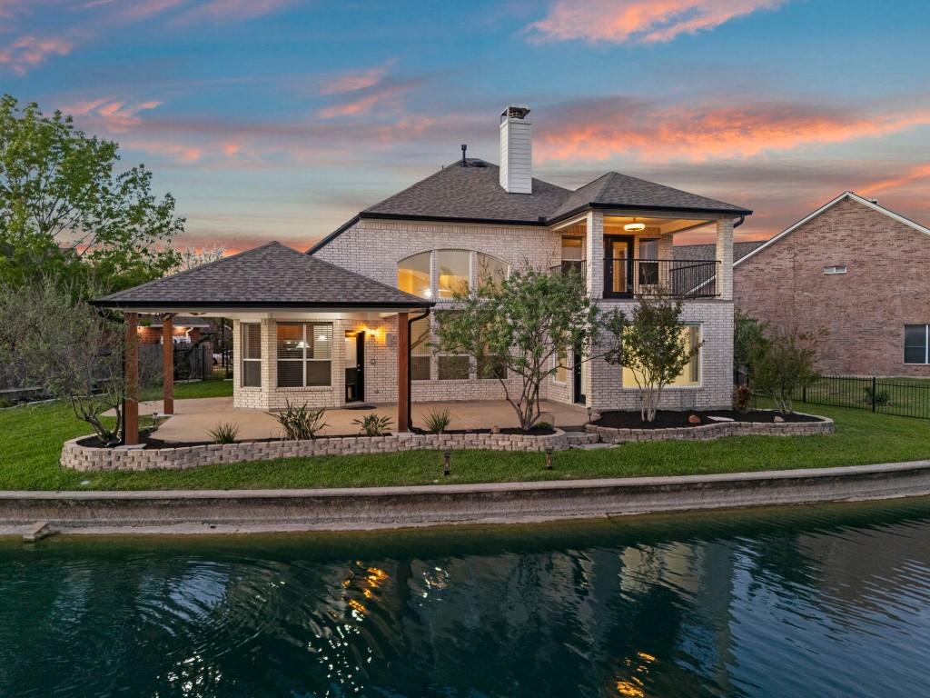 10103 Lazy Lagoon Houston, TX 77065 - Photo 1 of 50 a front view of a house with a garden