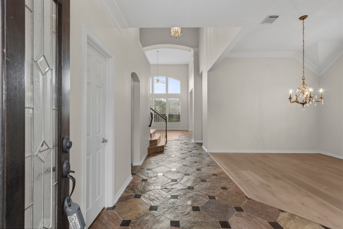 10103 Lazy Lagoon Houston, TX 77065 - Photo 12 of 50 a view of a hallway to a room with wooden floor and a bathroom