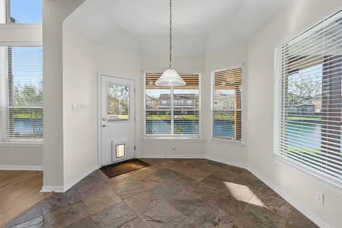 a view of a room with windows